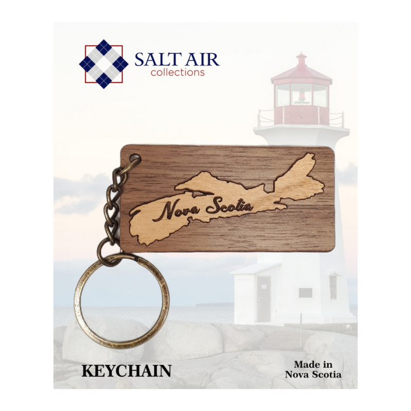 Nova Scotia walnut and alder wood keychain by salt air collections. wooden made in Nova Scotia keychain that features the outline of the province and the name of the province within the outline.